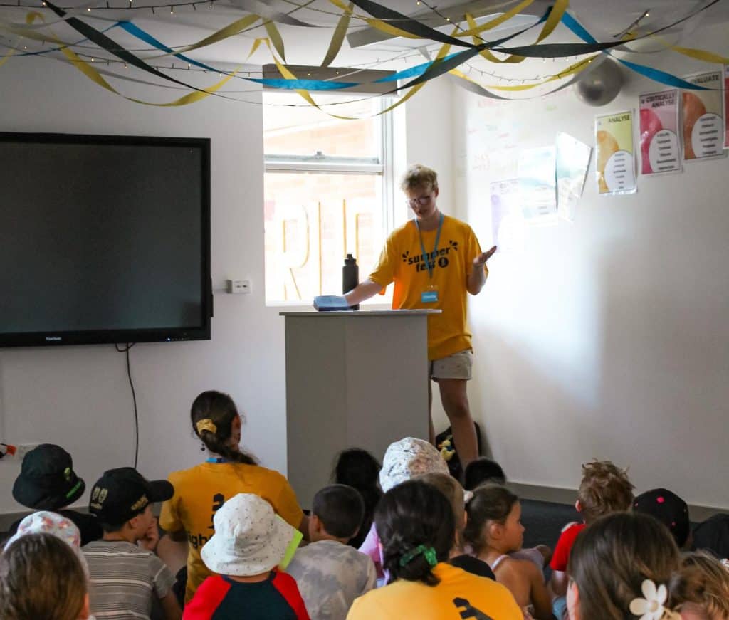 Volunteer teaching kids at Lighthouse Church