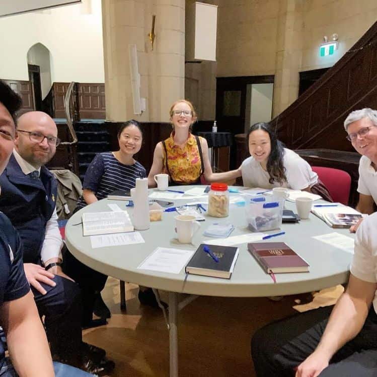 Team discussion around table at Scots Church Sydney